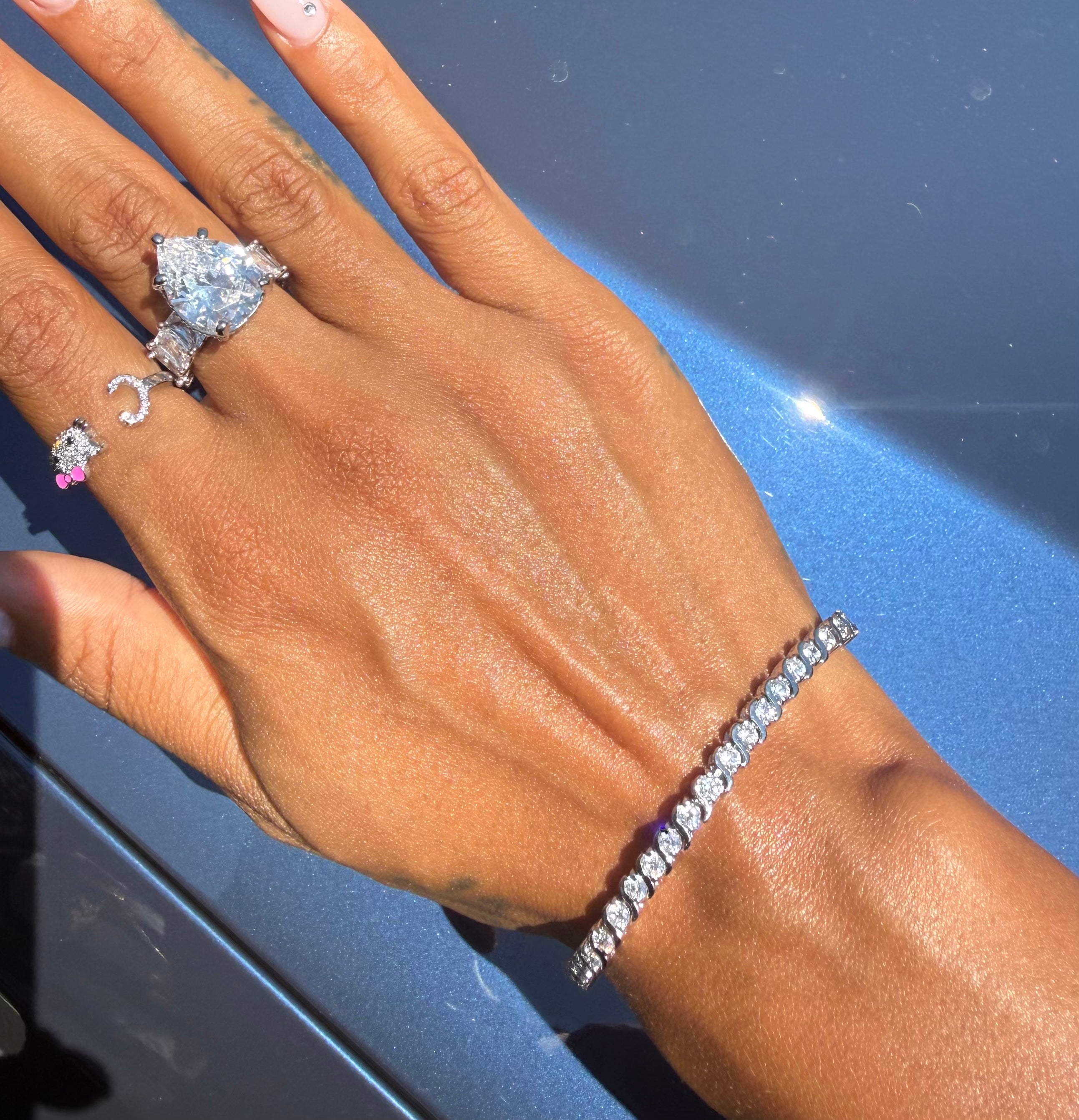 On The Rocks silver tennis bracelet worn on wrist