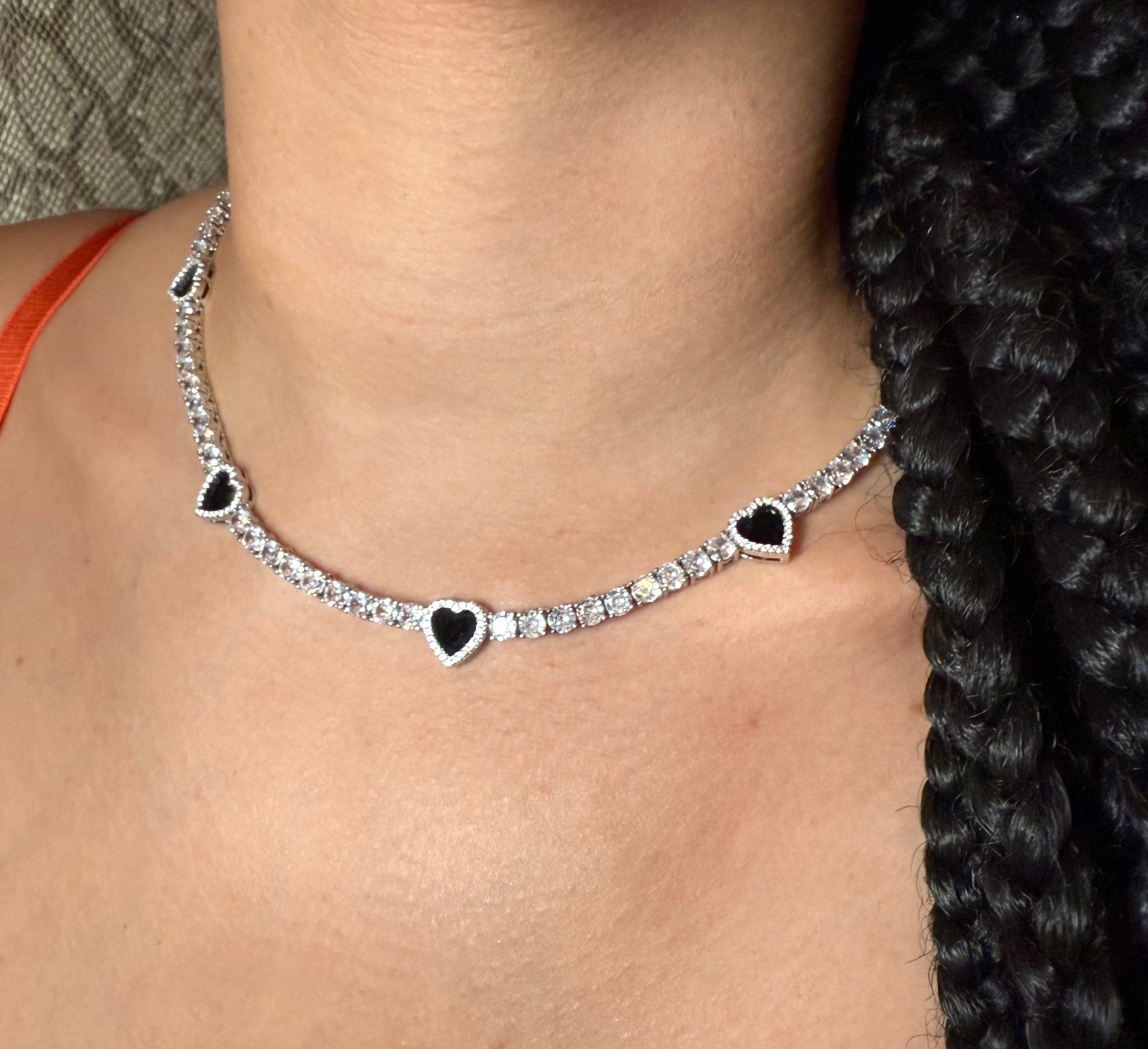 Black Hearts Tennis Necklace — seven black hearts outlined in cubic zirconia on silver-plated tennis chain — CharmBox black hearts tennis necklace
