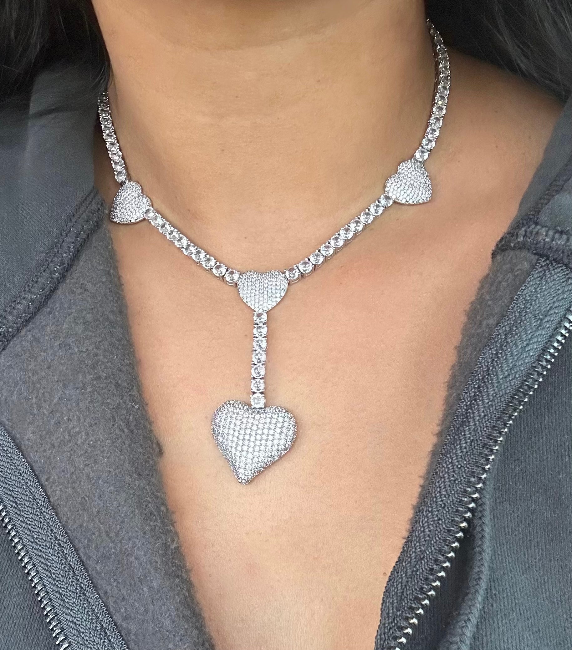 Drop Heart Tennis Necklace — three accent hearts and drop-heart pendant on a silver tennis chain — CharmBox drop heart tennis necklace