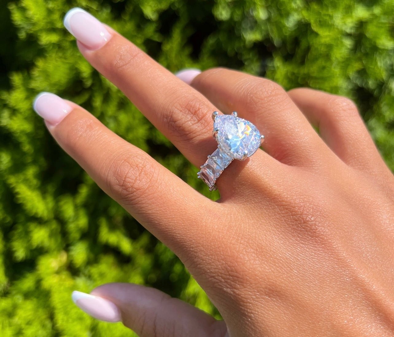 Wife Me Ring — pear-cut center stone on an emerald-eternity band in silver or pink — CharmBox wife me ring